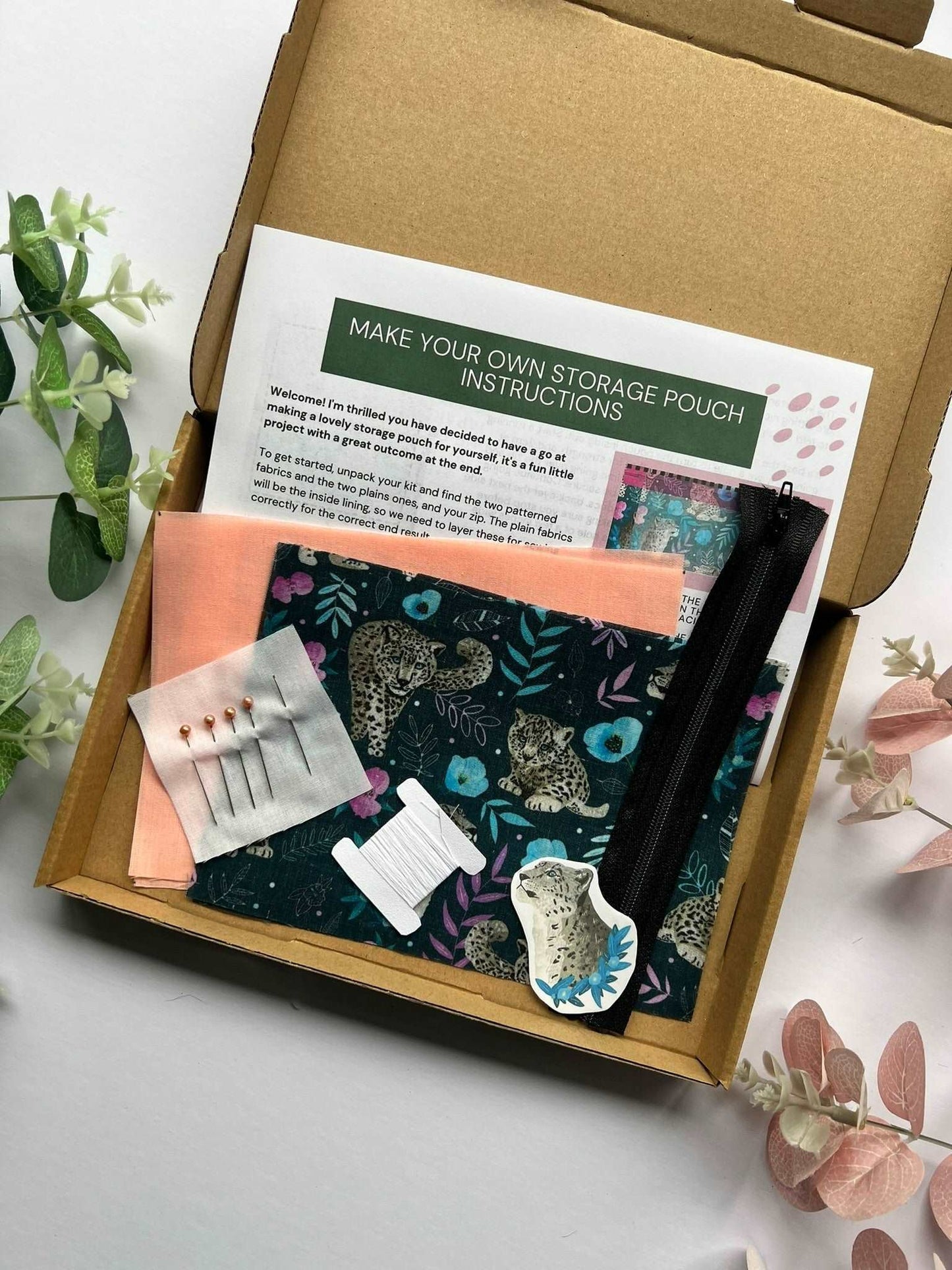 Learn how to make a makeup bag with our Snow Leopard DIY Kit.