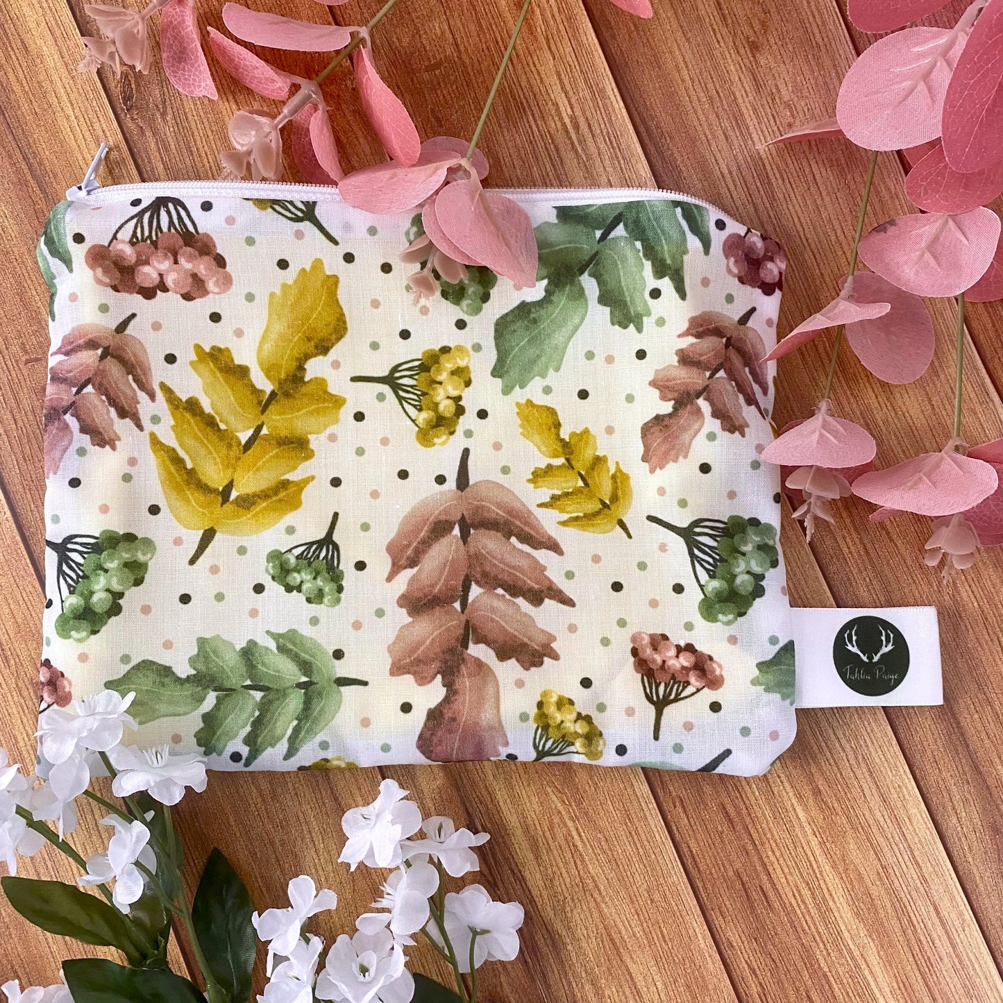 pretty foliage pattern on wooden surface with foliage around it