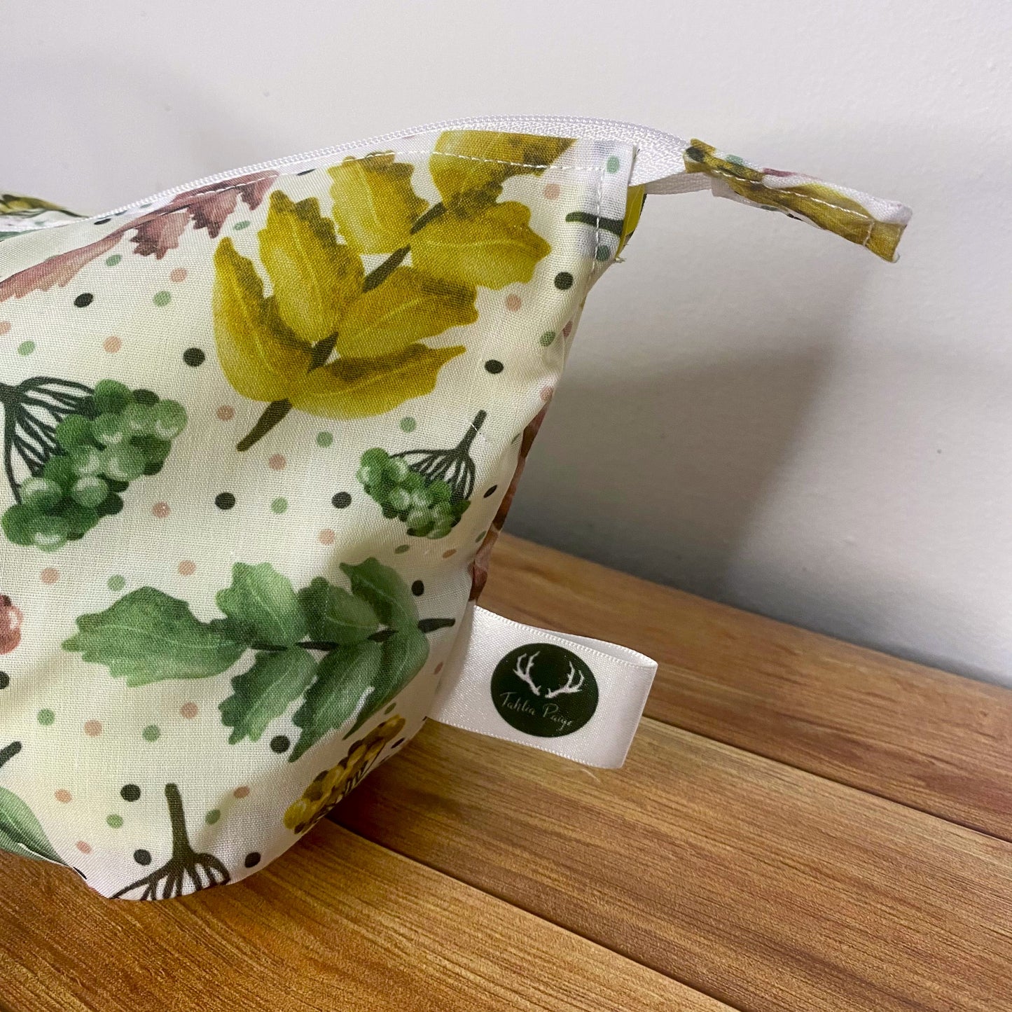closeup of the pretty foliage patterned makeup bag side