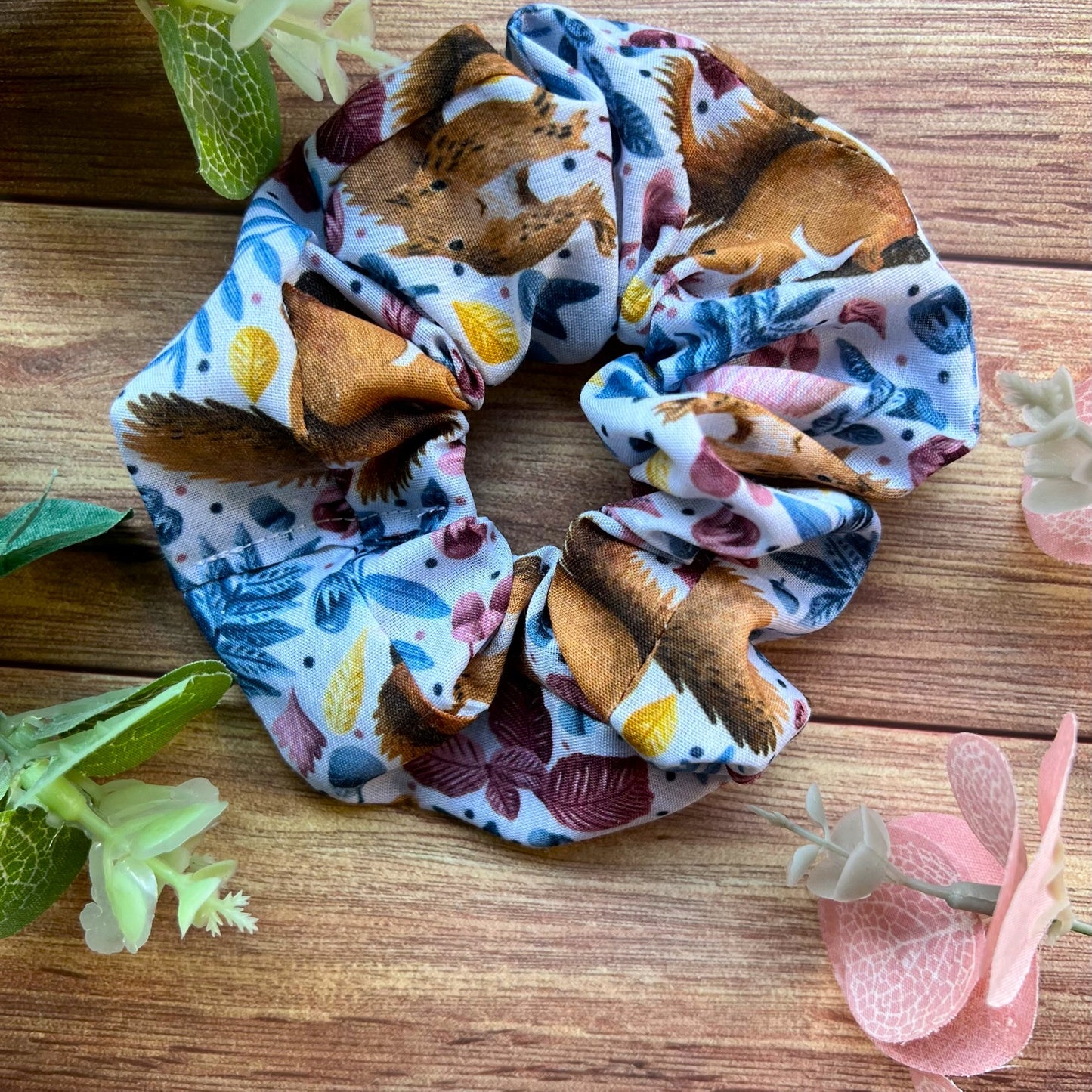 Stylish red squirrel scrunchie, perfect hair accessory for women and a budget-friendly gift