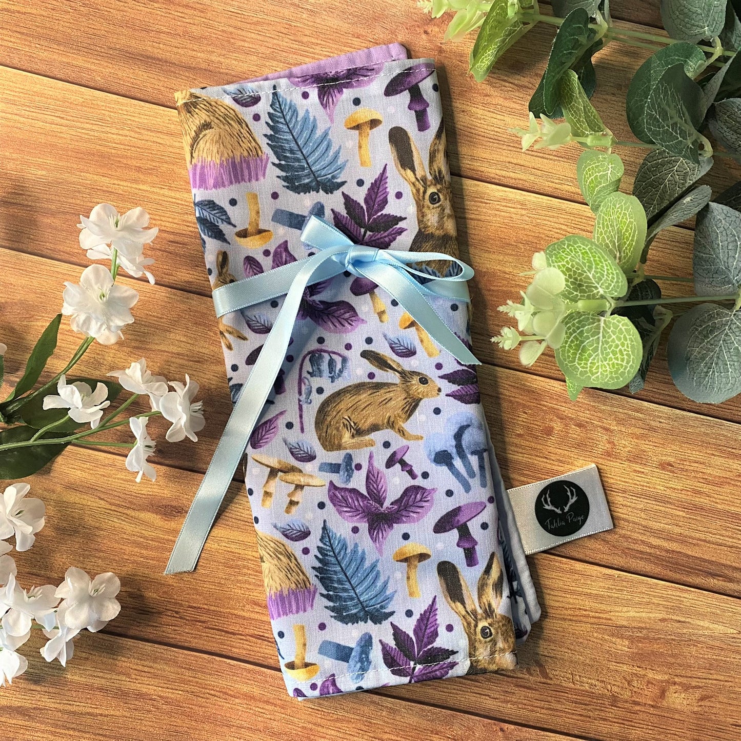 our fold out makeup bag for storing brushes is an ideal gift for hare lovers, with a blue ribbon to keep it securely closed