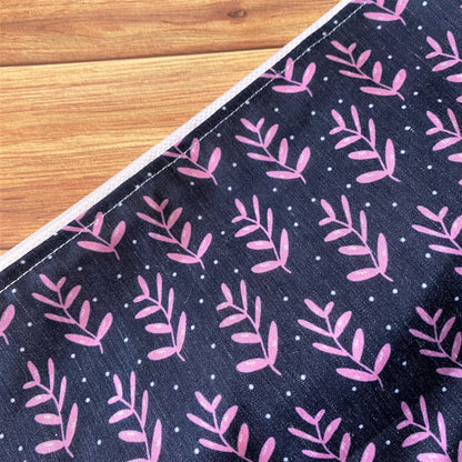 close up of the dark foliage pattern with pink leaves.