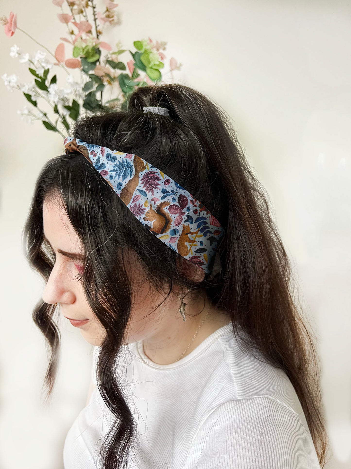 Stylish headband knot in a red squirrel hair care gift set, ideal for gifting and self-care.