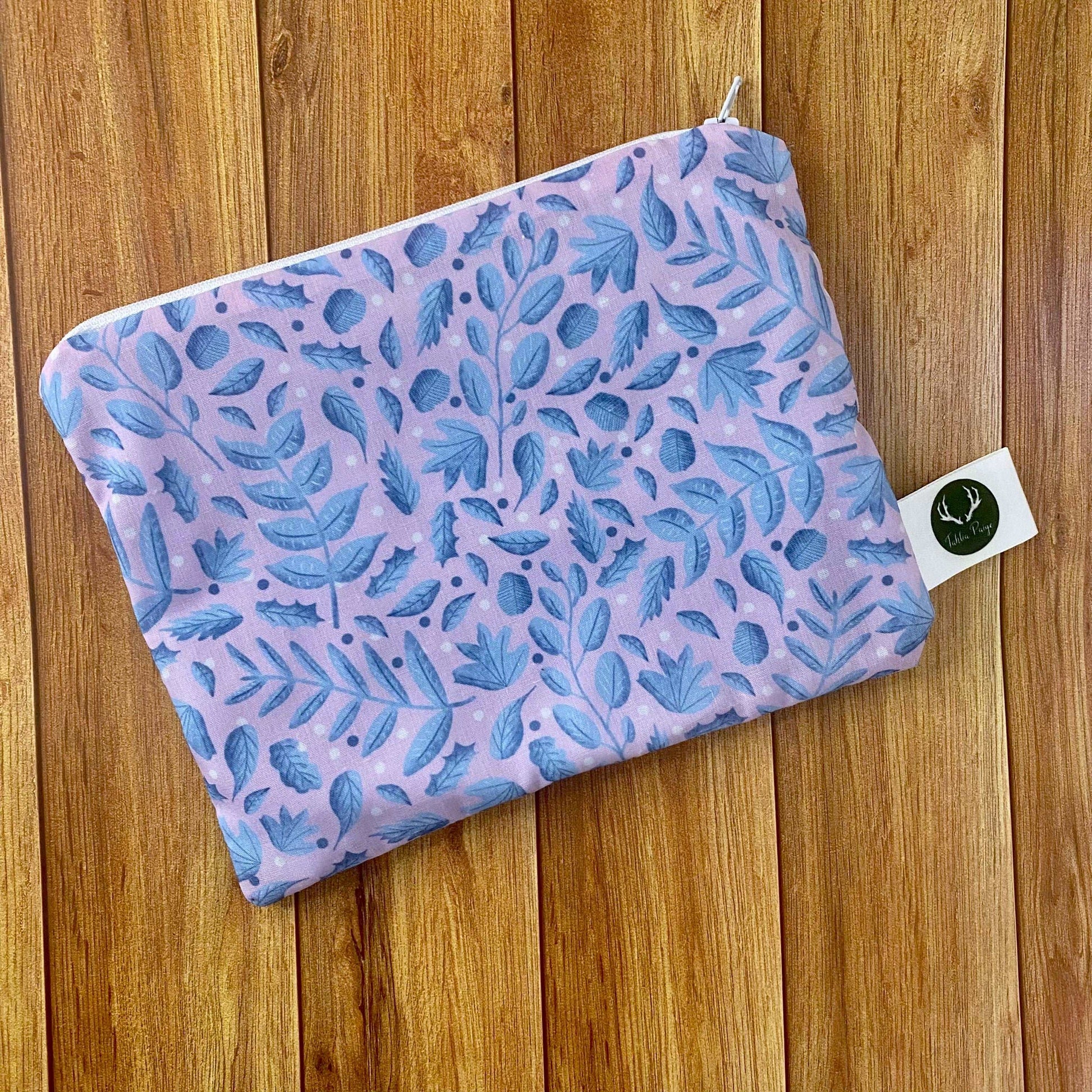 ideal for a woman who has everything, our storage pouches come in a range of patterns, including this blue and pink leaf design