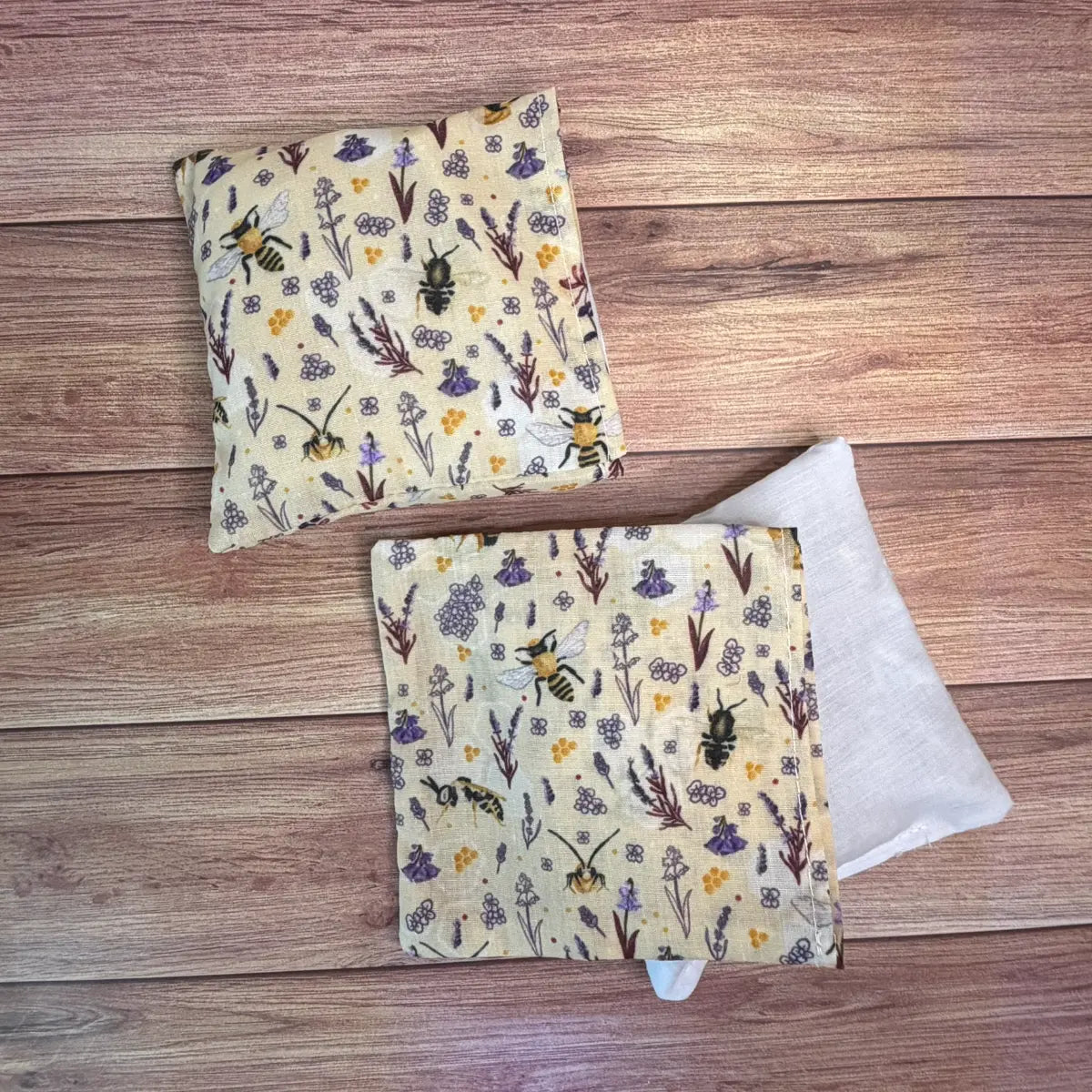 Handmade bee hand warmers featuring original Tahlia Paige illustrated bee artwork.
