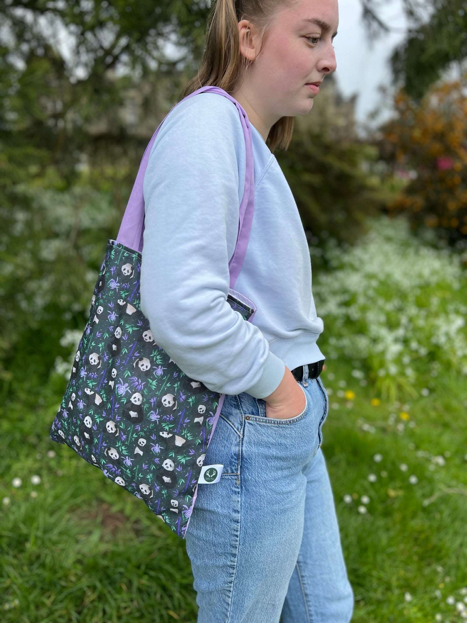 Versatile panda tote bag for work or carrying books, ideal for panda lovers.