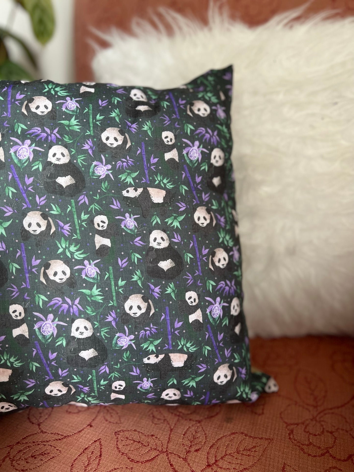 Best gifts for panda lovers, a cushion is a great way to brighten up a sofa. This decorative cushion for a sofa has a lovely panda pattern in a dark purple.