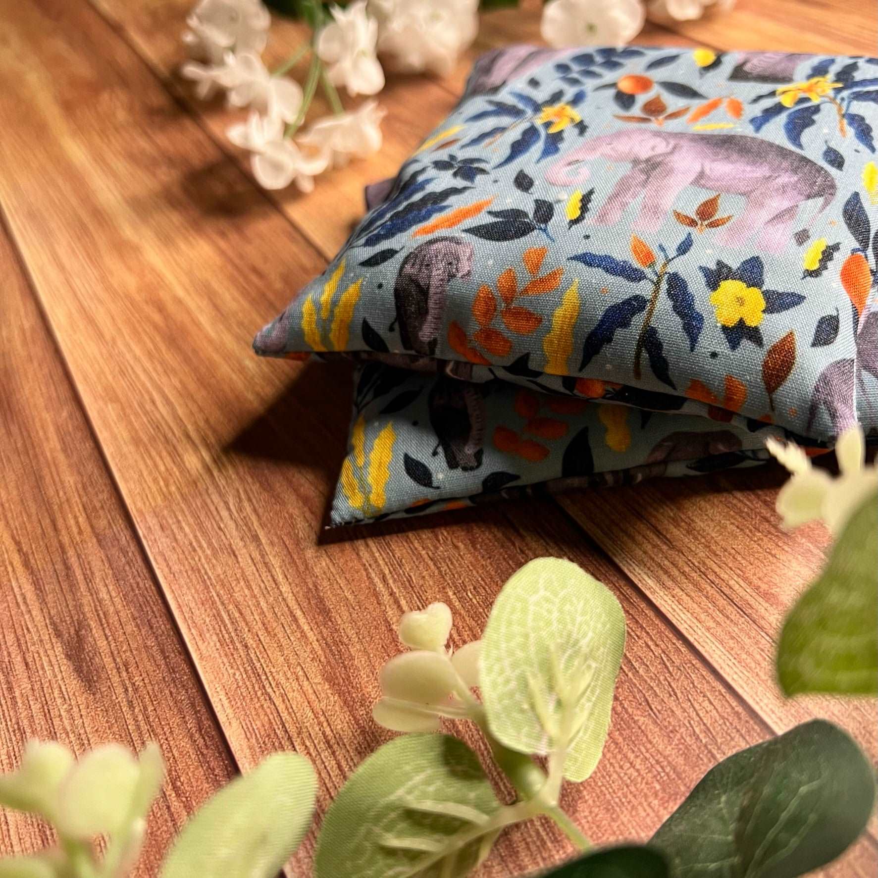 Closeup of elephant hand warmers, ideal for those with cold hands all the time this winter, these blue elephant patterned hand warmers are handmade right here in wales