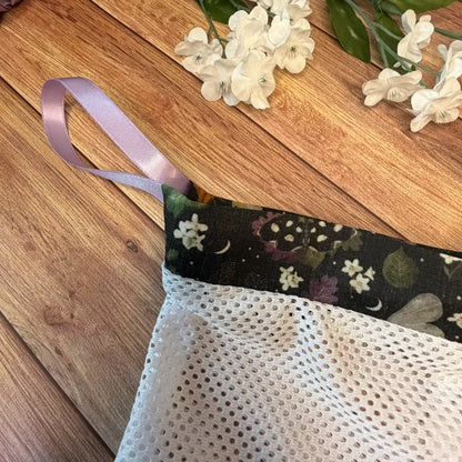 Moth patterned mesh washing bag with white netting and cotton fabric detailing.
