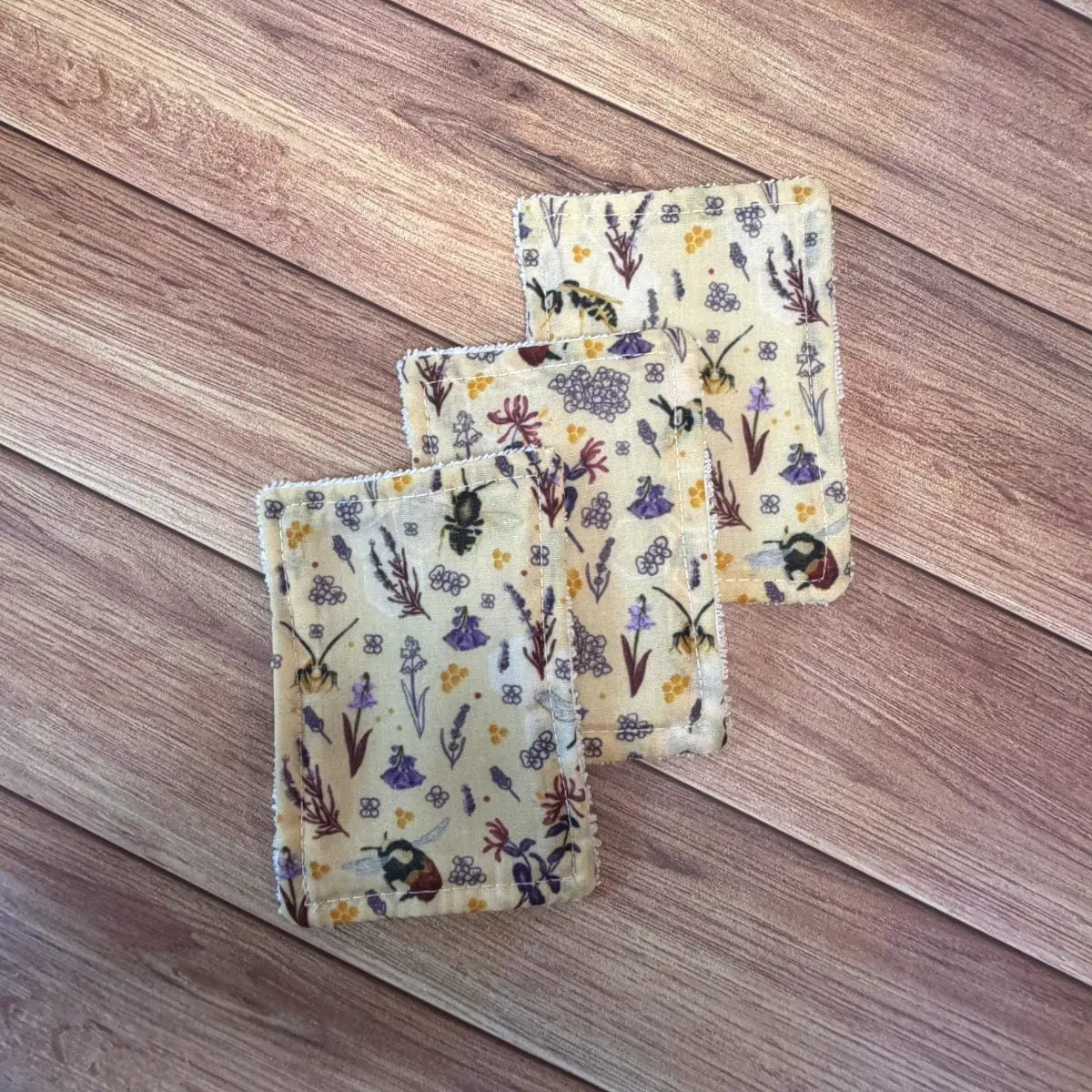 Reusable bee patterned skincare accessories suitable for physical exfoliation.
