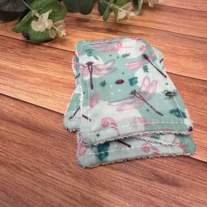 Reusable exfoliating accessories featuring printed avio cotton dragonfly patterns.
