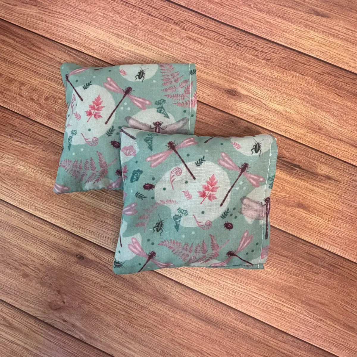 Reusable hand warmers made with patterned fabric and wheat and lavender filling.
