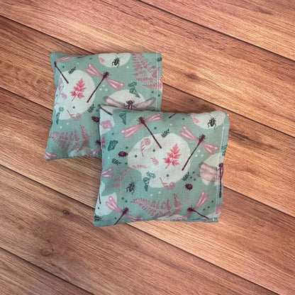 Reusable hand warmers made with patterned fabric and wheat and lavender filling.
