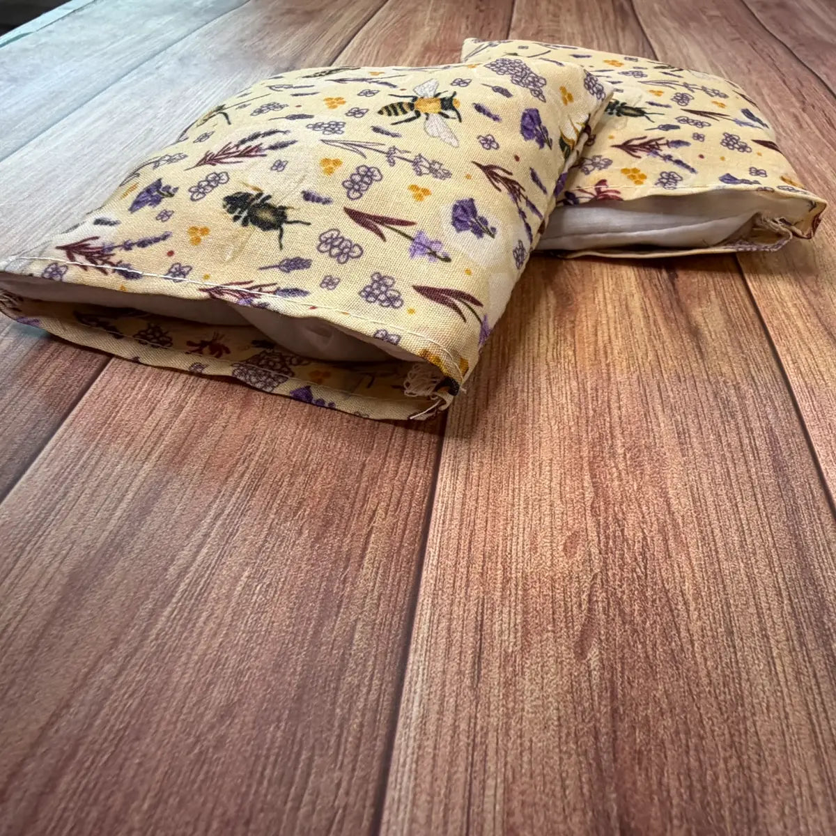 Small bee hottie wheat bag alternative designed for warming cold hands.
