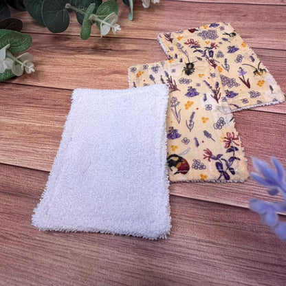 Washable bee facial exfoliating pads featuring patterned avio cotton backings.
