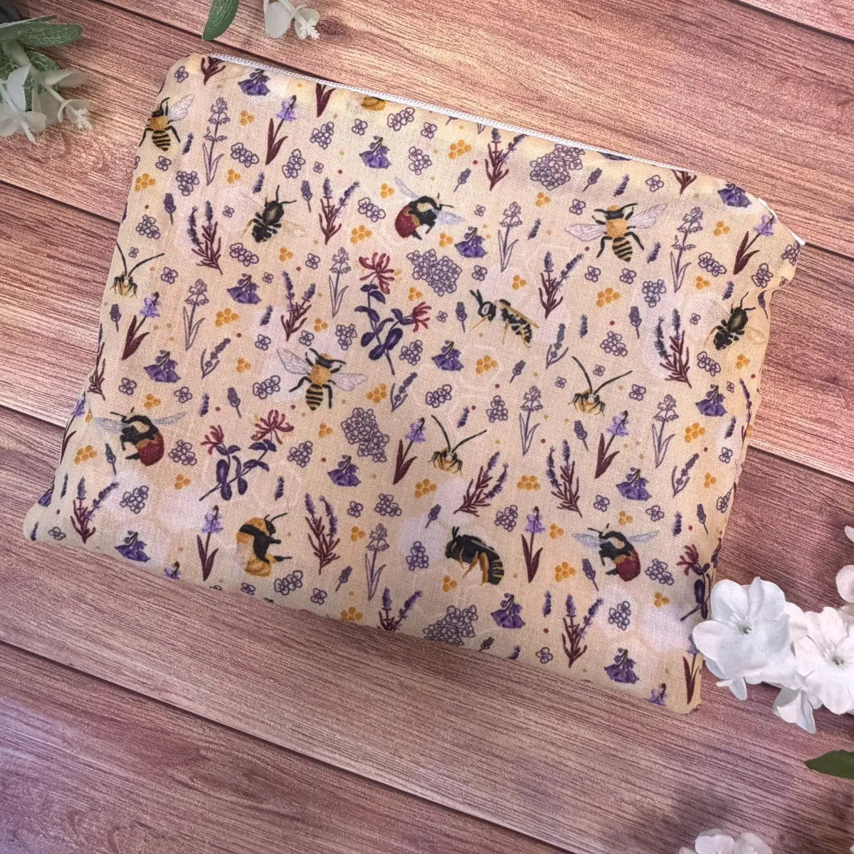 Handmade bee makeup bag featuring an original Tahlia Paige illustrated bee pattern.
