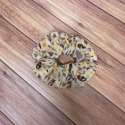 Handmade bee accessories including a cotton scrunchie with gathered fabric.
