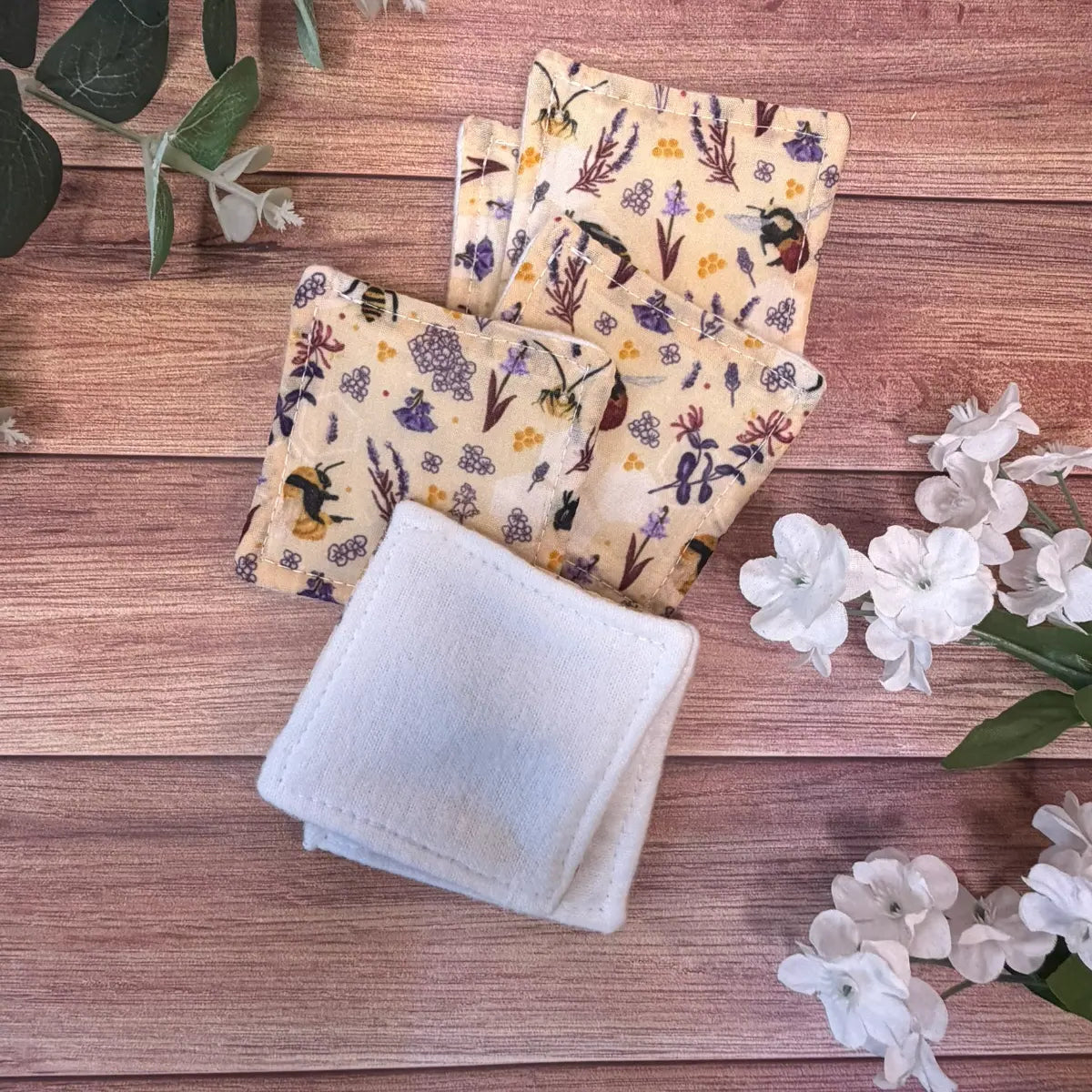 Six handmade bee reusable skincare pads featuring original Tahlia Paige illustrated bee artwork.
