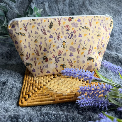 Handmade bee toiletry bag for travel featuring original Tahlia Paige illustrated bee artwork.
