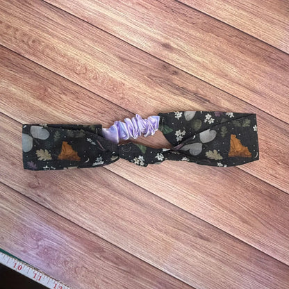 Black hairband with original illustrated insect artwork.
