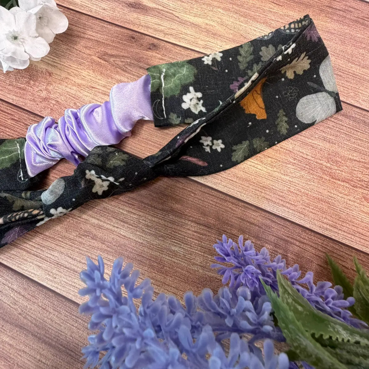 Handmade moth patterned hair accessory featuring a dark background.
