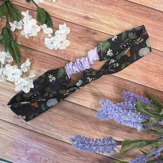 Handmade black hairband featuring original Tahlia Paige moth illustrations.
