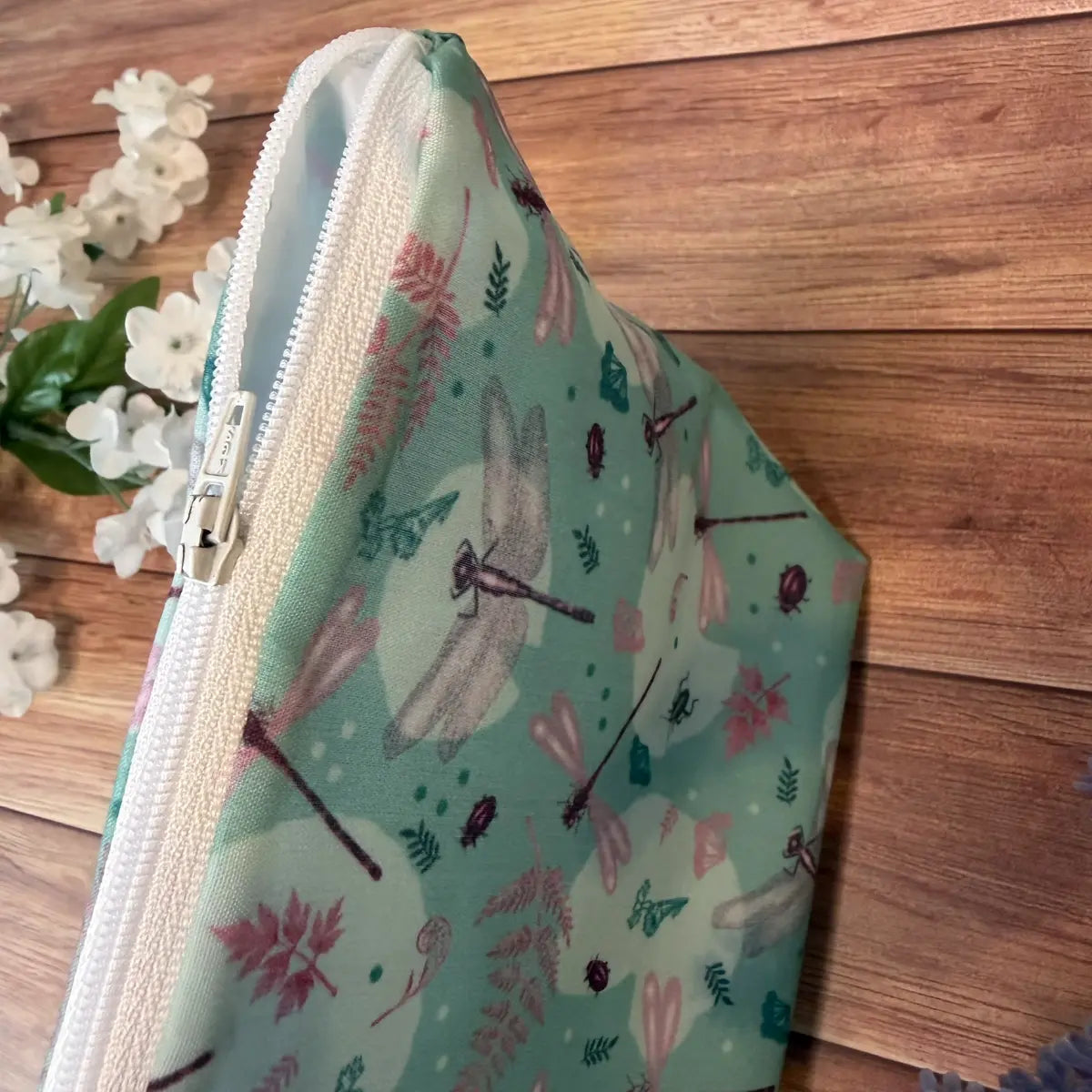 Handmade dragonfly patterned cosmetic bag with waterproof lining for holidays and everyday storage.
