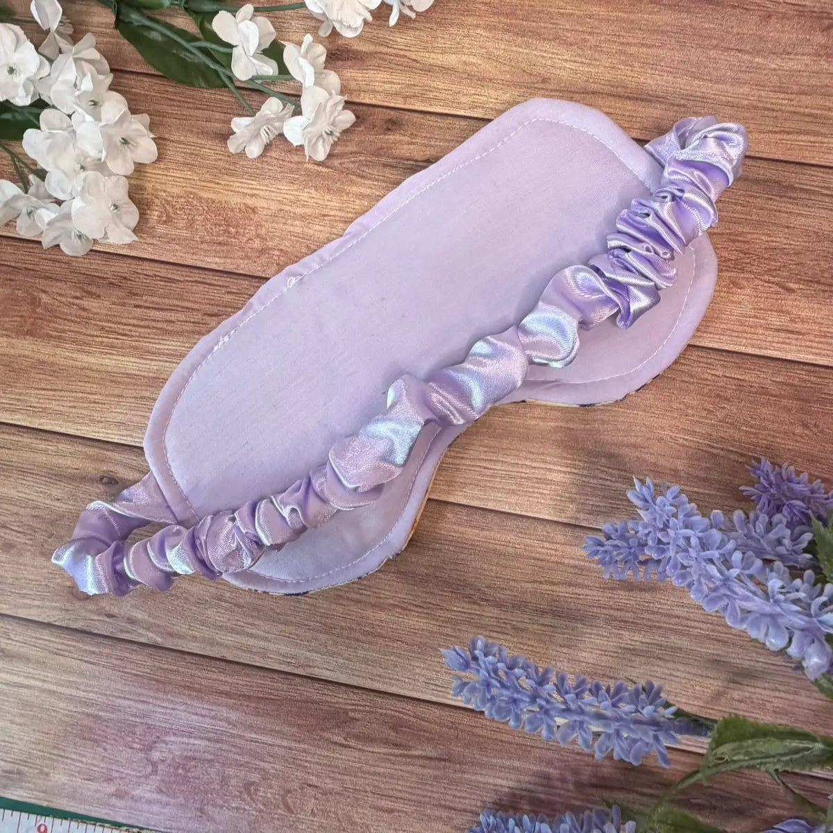 Handmade bee sleep mask with a fabric-covered elasticated strap.
