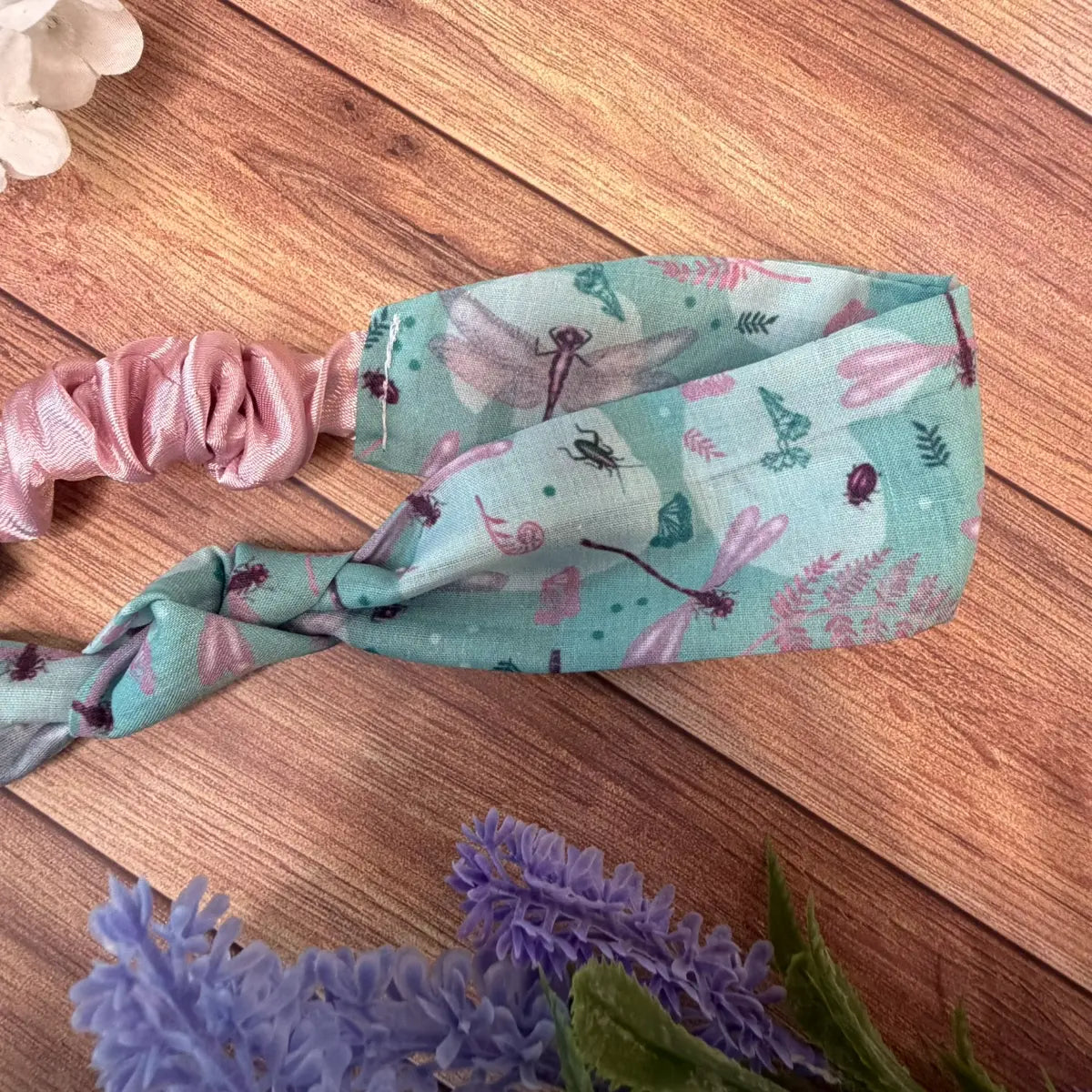 Dragonfly fabric hair accessory decorated with repeating illustrations.
