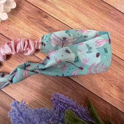 Dragonfly fabric hair accessory decorated with repeating illustrations.
