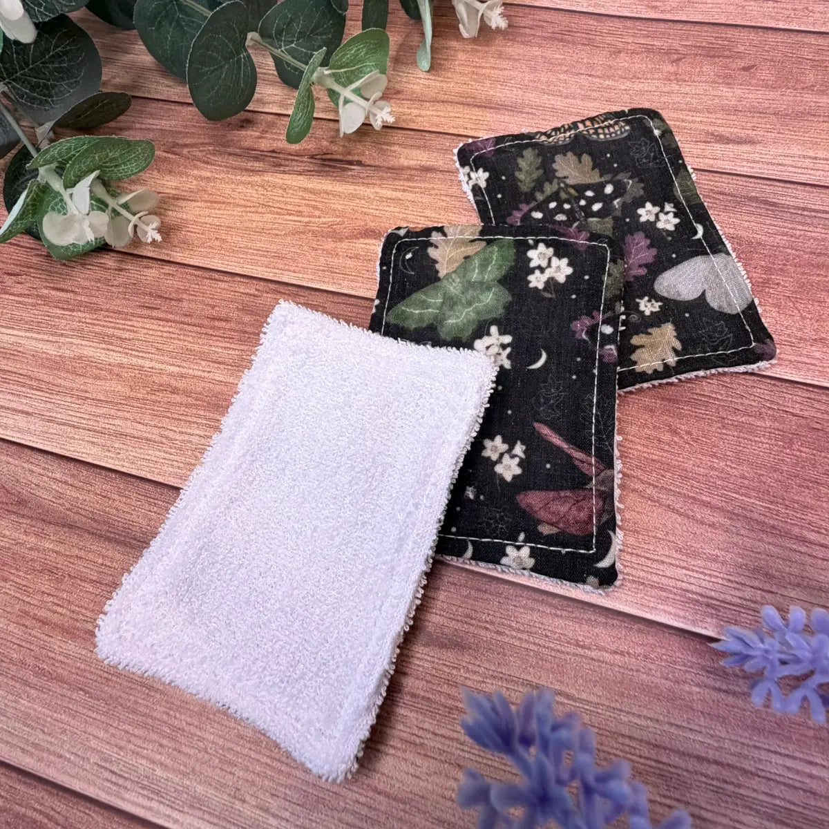 Washable fabric face pads with original illustrated moth designs.
