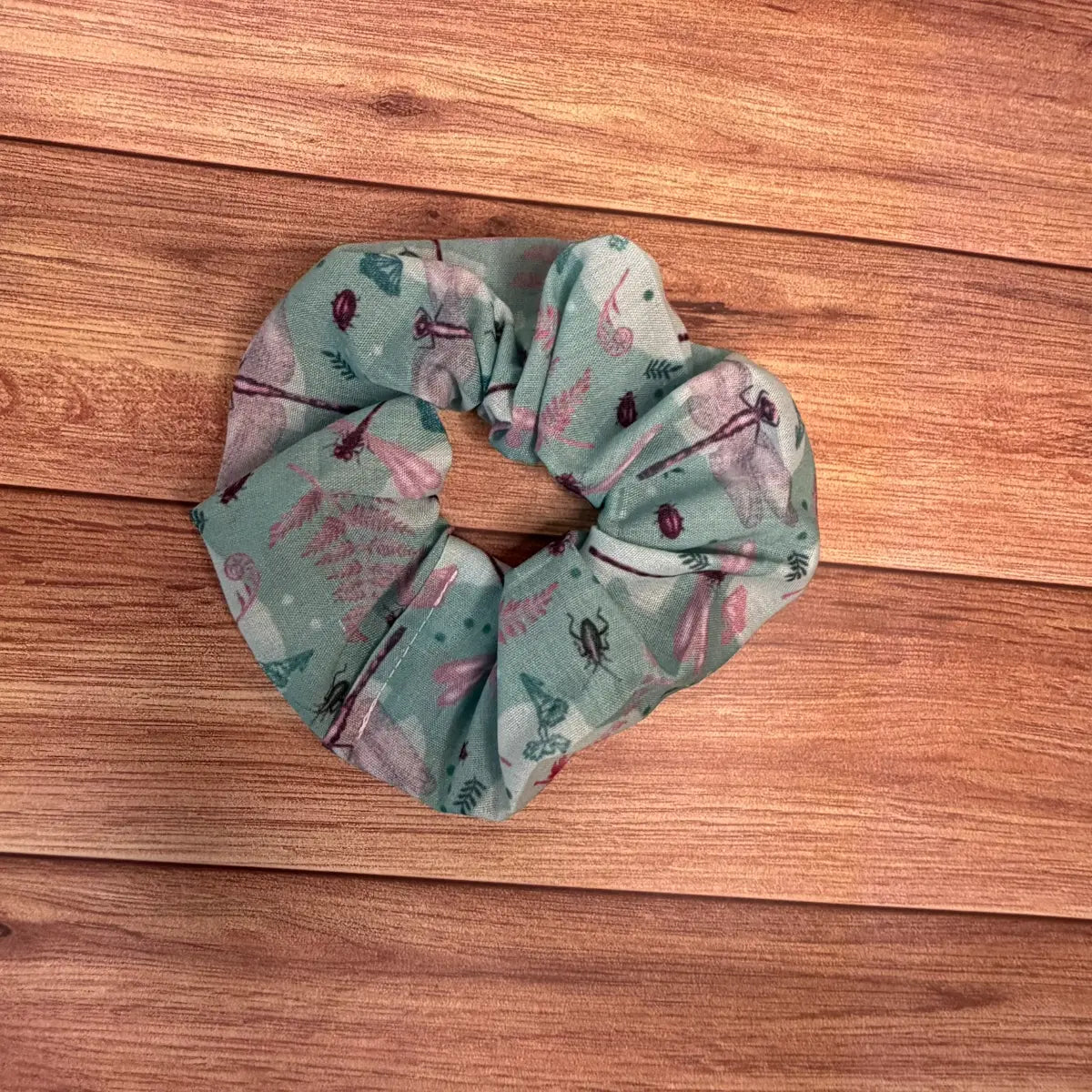 Handmade hair ties for women featuring a repeating dragonfly design.
