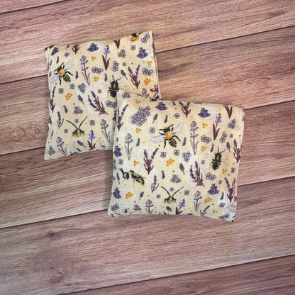 Bee patterned hottie wheat bag style hand warmers filled with wheat and lavender.
