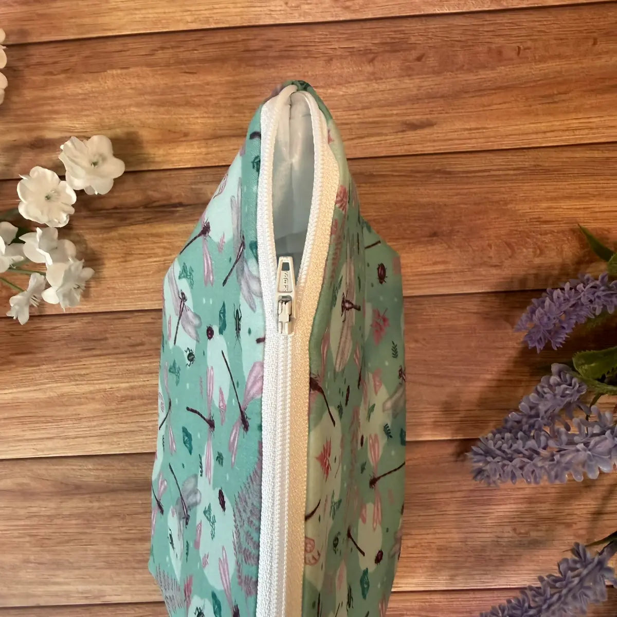 Large wash bag decorated with dragonfly artwork, suitable for toiletries and makeup brushes.
