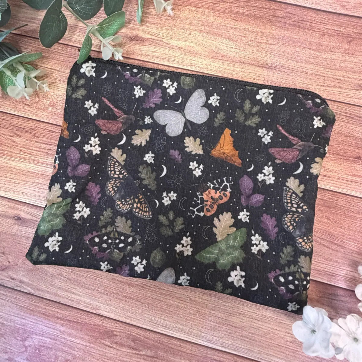 Handmade moth cosmetic pouch featuring original Tahlia Paige illustrated moth artwork.

