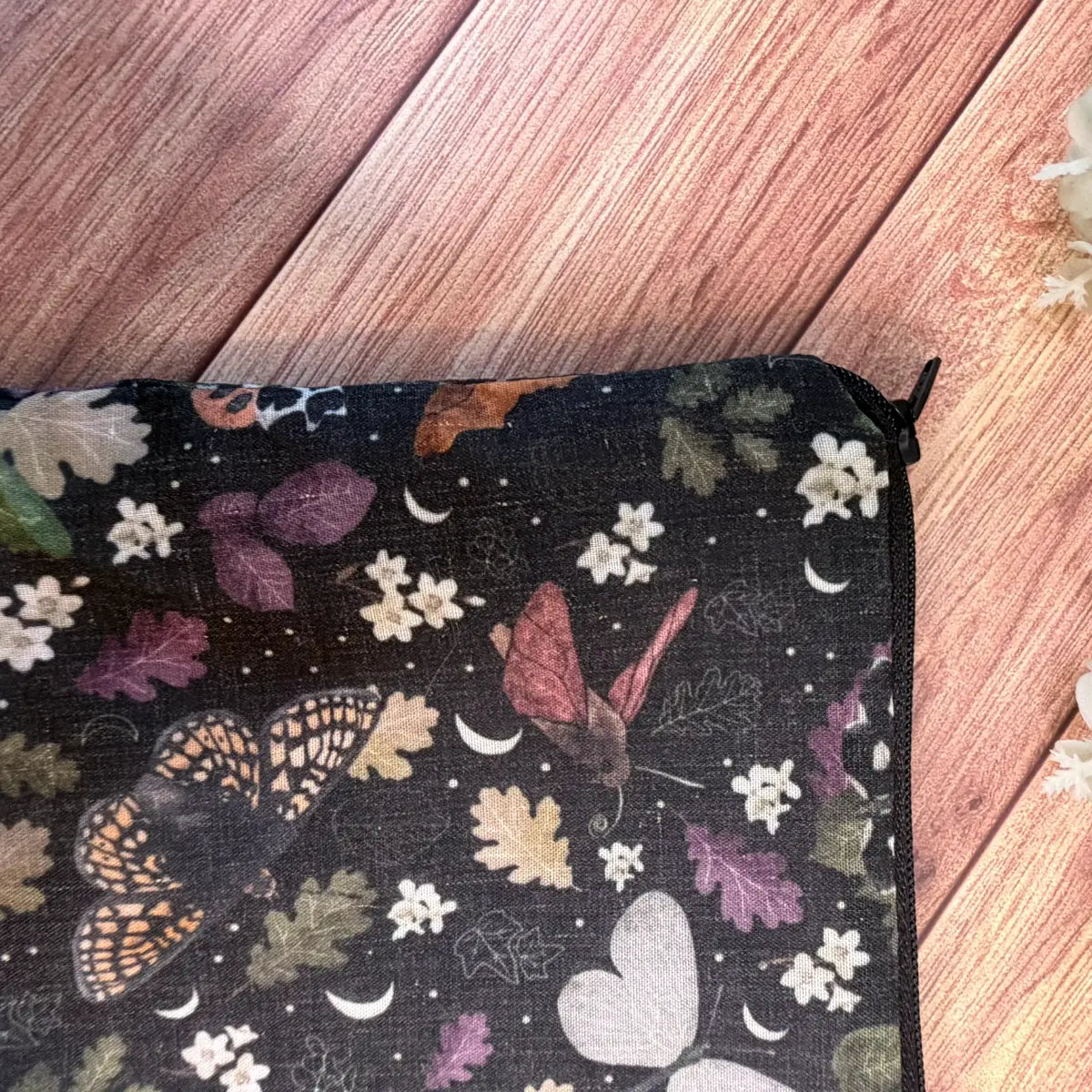 Moth patterned cosmetic pouch made from soft avio cotton with a polycotton lining.
