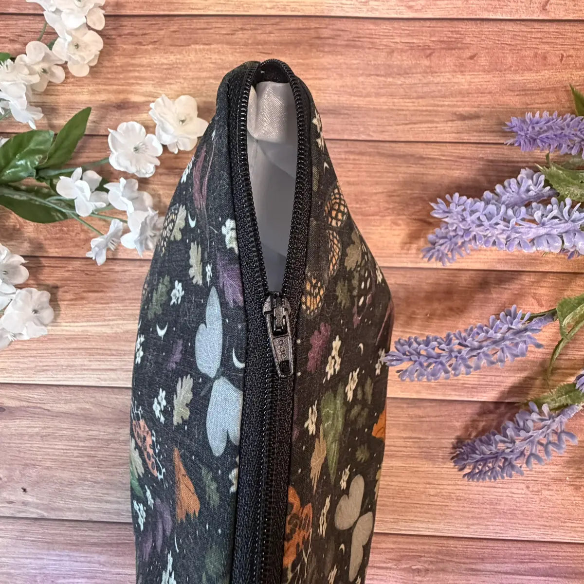Handmade black moth patterned wash bag for toiletries, cosmetics and travel accessories.
