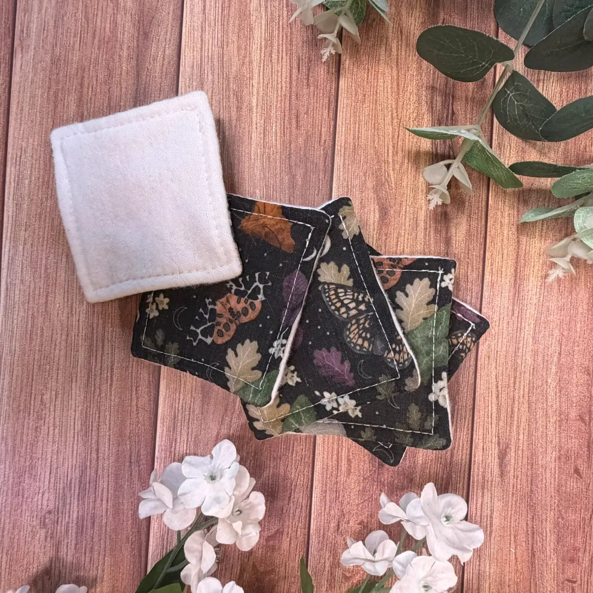 Moth makeup removal pads with soft white brushed cotton surfaces and printed fabric backings.
