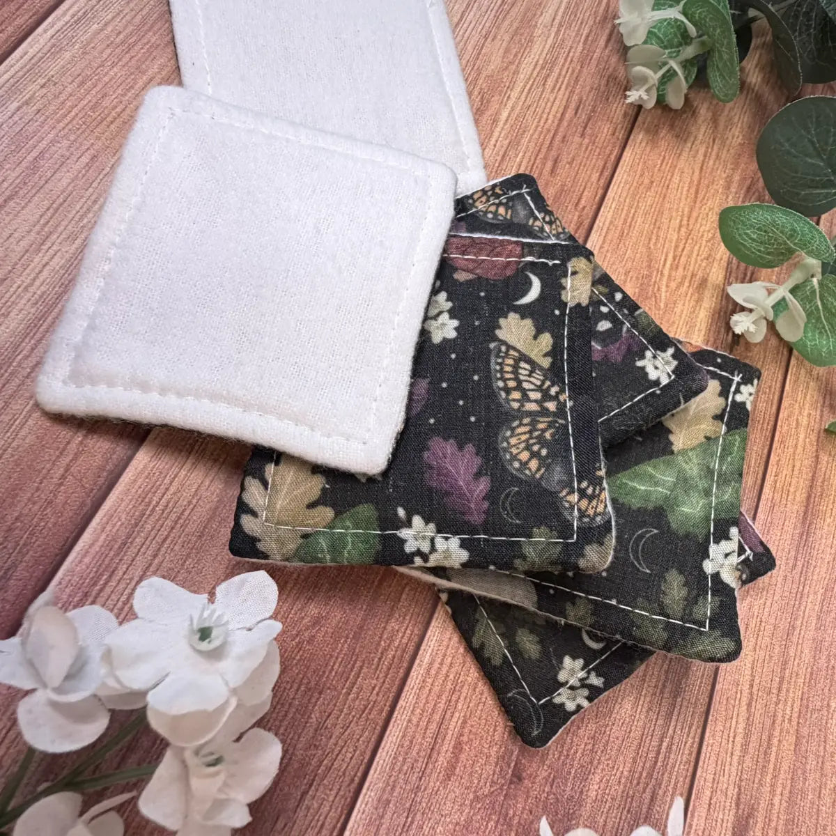 Six lightly padded moth skincare pads featuring original illustrated insect artwork.
