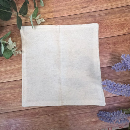 Handmade reusable face cloth featuring original repeating dragonfly artwork.
