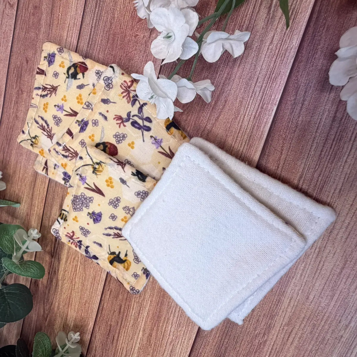Handmade bee skincare accessories featuring six lightly padded fabric pads.
