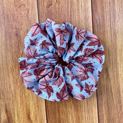 pink leafy patterned scrunchie on wooden backdrop