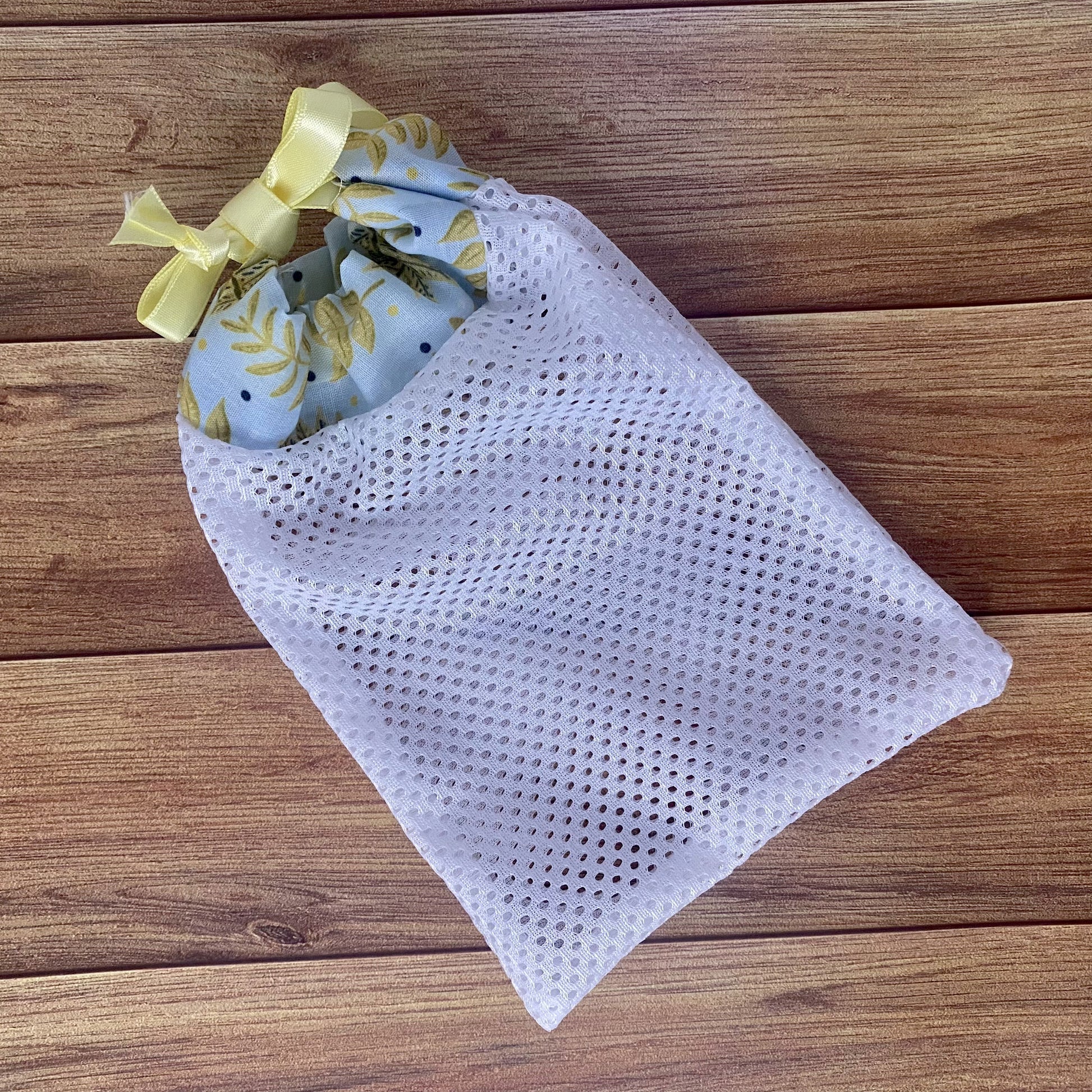 yellow foliage patterned washbag on wooden background