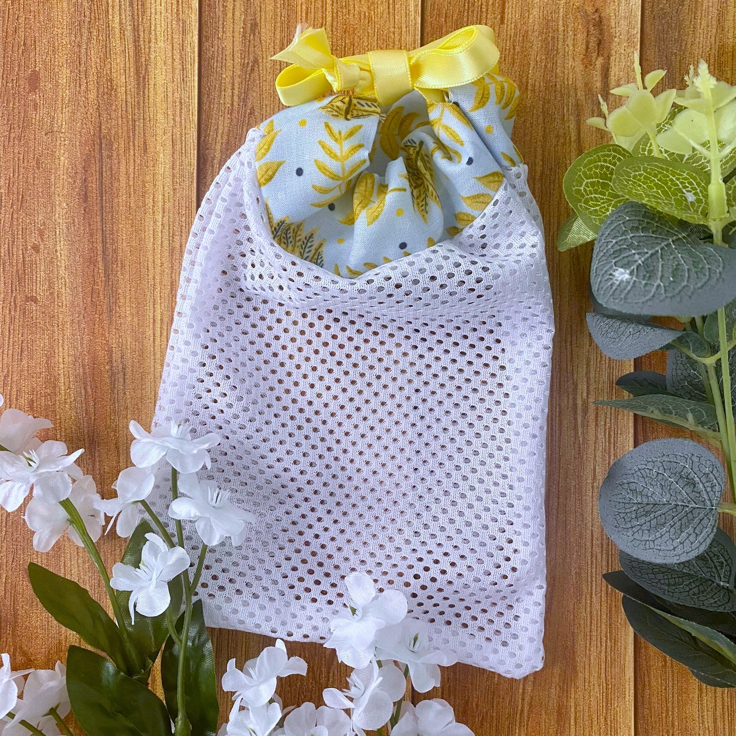 yellow foliage patterned washbag on wooden background