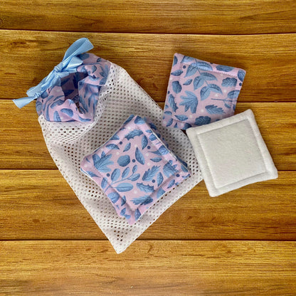 blue foliage makeup removal pads with matching washbag on a wooden background