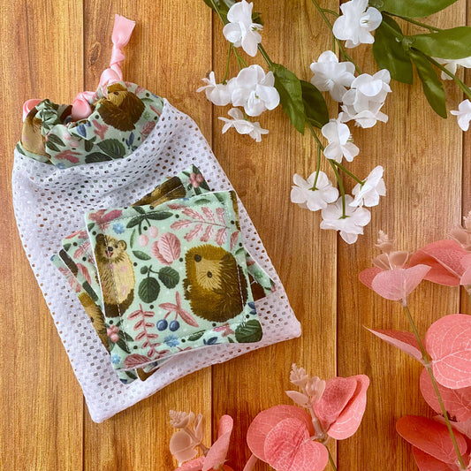 hedgehog patterned skincare pads and washbag set on wooden background