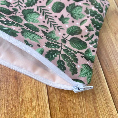 pink lining inside of the green foliage storage pouch, which makes a great cosmetic bag gift for a nature lover