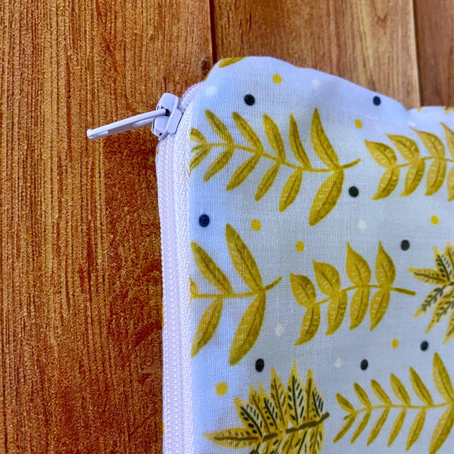 closeup of the yellow foliage cosmetic bag for handbag, small enough to fit in but store supplies safely. Enjoy a gift for you today.