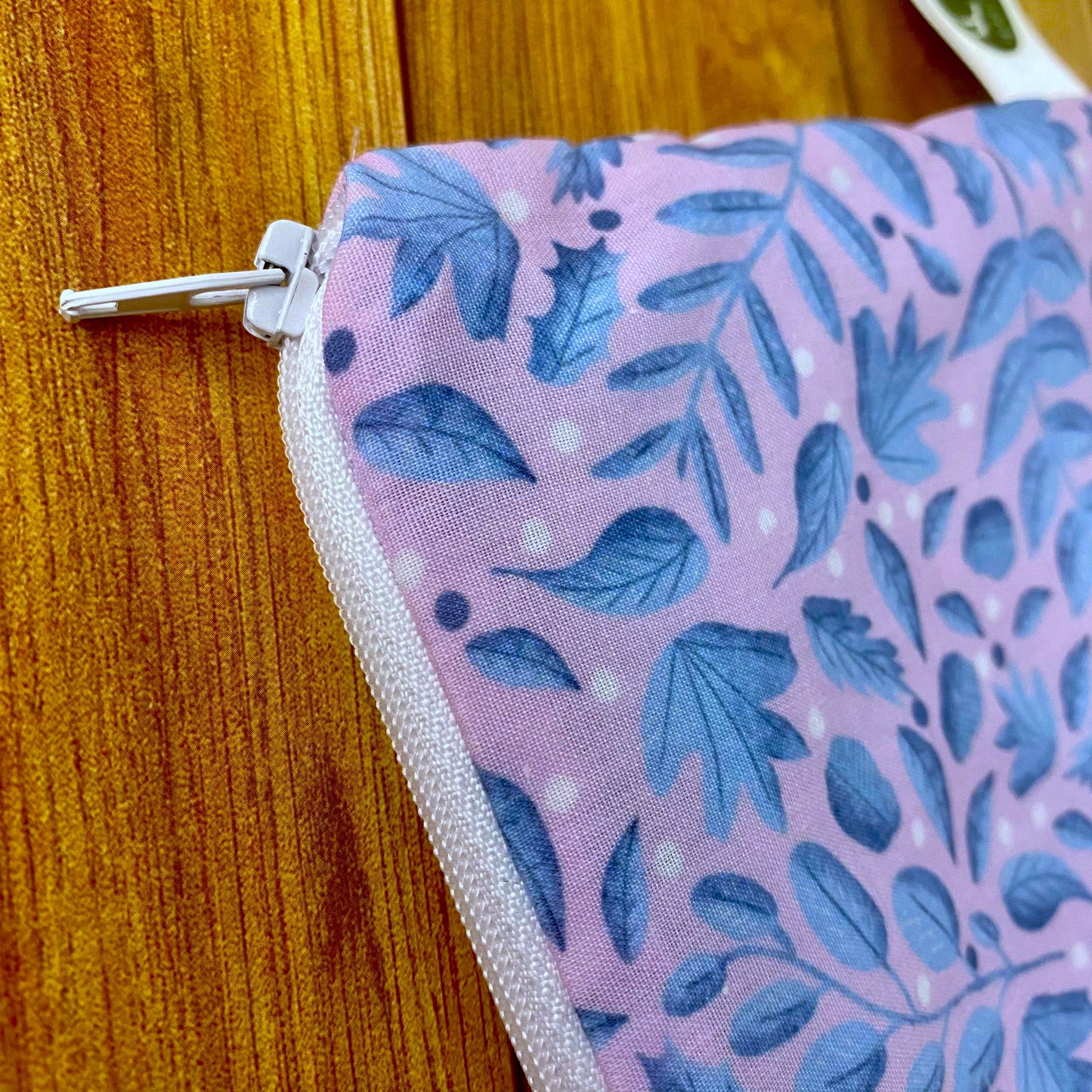 closeup of a handmade storage pouch with a blue patterned leaf design, ideal for a woman who has everything
