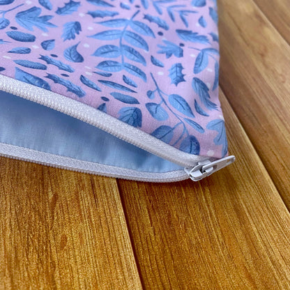Closeup of the pouch opening with the white zip, showing the blue lining inside of the storage pouch, which makes an ideal gift for a woman who is difficult to buy for.